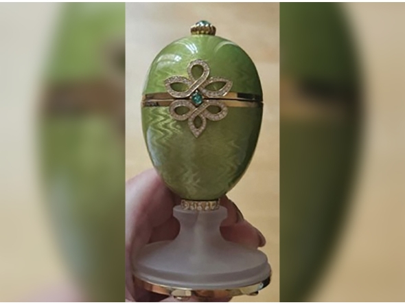 This undated handout photo released by the Metropolitan Police to AFP on April 9, 2026 shows a green and gold, emerald-encrusted Faberge egg, which was stolen from outside a pub in 2024. Photo by Handout / Metropolitan Police / AFP