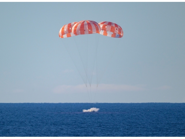 This handout photo released by NASA shows NASA's Orion spacecraft as it lands in the Pacific Ocean off the coast of California, on April 10, 2026. (Photo by Bill INGALLS / NASA / AFP) 