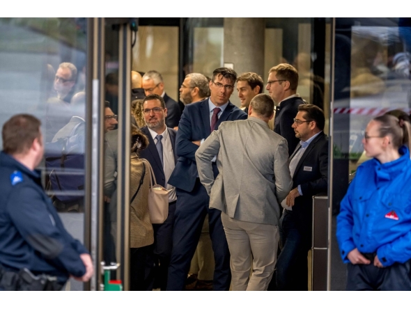 Lawyers wait to enter the room for the hearing of the Mayor of Crans-Montana Nicolas Feraud as part of the investigation over the fire that broke out in the 