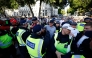 A protestor remonstrates with police officers during the 'Enough is Enough' demonstration on Whitehall, outside the entrance to 10 Downing Street in central London on July 31, 2024, held in reaction the Government's response to the fatal stabbings in Southport on July 29. (Photo by BENJAMIN CREMEL / AFP)