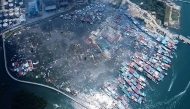 This handout photo taken and released by Malaysia's Sandakan Fire and Rescue Department on April 19, 2026, shows a general view of the Kampung Bahagia water village after a fire, in Sandakan, on Malaysia's Borneo island. (Photo by Handout / Malaysia's Sandakan Fire and Rescue Department / AFP)