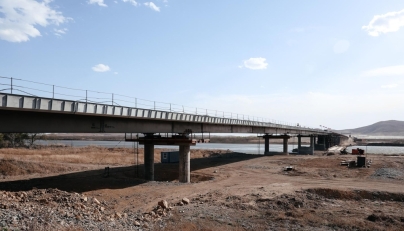 This handout image released by the Russian Transport Ministry on April 21, 2026, shows the under construction road bridge over the Tumen River connecting Russia and North Korea, set to open this summer. (Photo by Handout / Russian Transport Ministry / AFP) 
