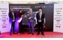 The winner with the officials during the key handover ceremony. Pic: Salim Matramkot
