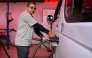 NEPAL-TRANSPORT-AUTOMOBILE-ENERGY
Electric microbus driver Purushottam Adhikari charges his vehicle at a charging station in Kathmandu on May 1, 2026. As global fuel markets reel from the Middle East war, motorists in Nepal are increasingly turning to electric vehicles, with high demand putting a strain on dealerships. 
(Photo by Prakash MATHEMA / AFP) / TO GO WITH 'Nepal-Transport-Automobile-Energy' FOCUS