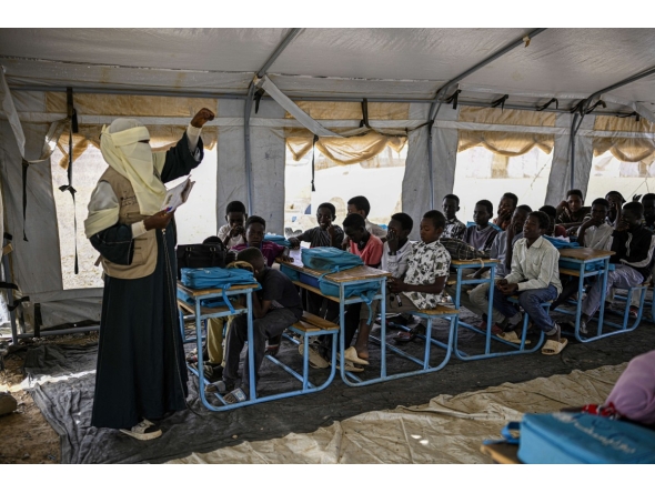 Displaced Sudanese students attend a class at an elementary school, south of Port Sudan, on April 26, 2026. Photo by Khaled Desouki / AFP
