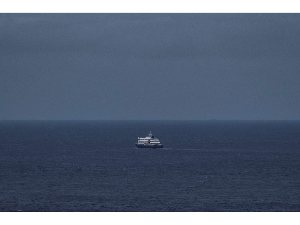 This general view shows the cruise ship MV Hondius, leaving the port of Praia, the capital of Cape Verde, on May 6, 2026. Photo by AFP