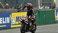 Aprilia Racing's Spanish rider Jorge Martin celebrates as he crosses the finish line to win the Moto GP Grand Prix of France at Le Mans, northwestern France, on May 10, 2026. (Photo by Loic VENANCE / AFP)