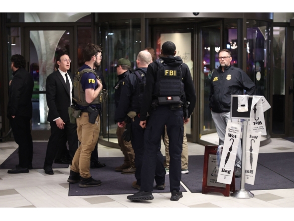 FBI agents are seen in the lobby of the Washington Hilton after shots were fired during the White House Correspondents' Dinner in Washington, DC, on April 25, 2026. (Photo by Alex Wroblewski / AFP)
