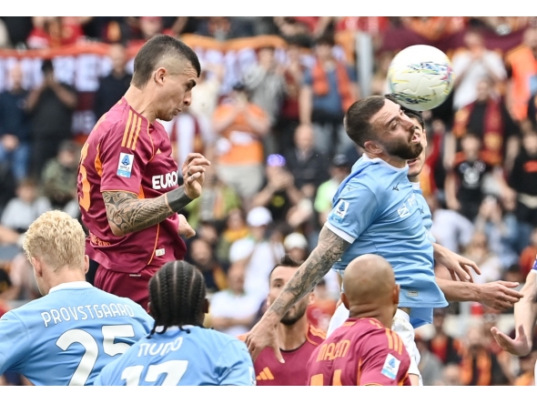 Roma's Italian defender #23 Gianluca Mancini heads the ball and scores his team's second goal during the Italian Serie A football match between Roma and Lazio at Olympic stadium in Rome on May 17, 2026. (Photo by Isabella BONOTTO / AFP)