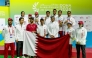 Qatar's medal-winning archers and officials pose for a photo.