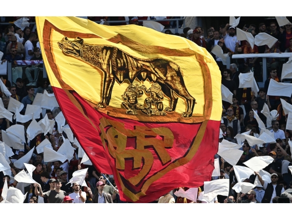 Roma's supporters wave a giant flag ahead of the Italian Serie A football match between Roma and Lazio at Olympic stadium in Rome on May 17, 2026. (Photo by Isabella BONOTTO / AFP)