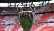 The trophy is displayed on the pitch prior to the UEFA Champions League final football match between Paris Saint-Germain (PSG) and Arsenal FC at the Puskas Arena in Budapest on May 30, 2026. (Photo by FRANCK FIFE / AFP)
