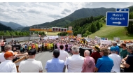 Protesters listen to speakers at the A13 Brenner Highway in the direction of Italy during a demonstration and the blockade of the Brenner Base Tunnel against transit traffic near the A13 Brenner Highway in the direction of Italy, on May 30, 2026, on the Tyrolean Brenner Highway. ](Photo by Joe Klamar / AFP)
