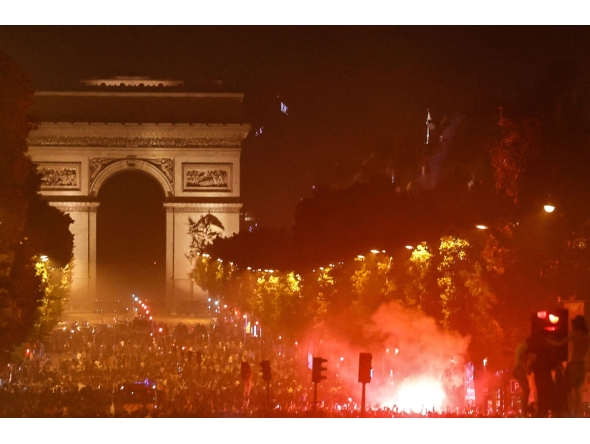 PSG supporters gather on the Champs-Elysees Avenue after the club won the UEFA Champions League final between Paris Saint-Germain (PSG) and Arsenal FC played in Budapest, in Paris on May 30, 2026. (Photo by ROMEO BOETZLE / AFP)