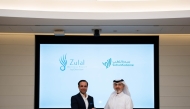 Acting Chief Executive Officer and a Member of the Board of Governors at Sidra Medicine, Mohammed Khalid Al Mana and  General Manager of Zulal Wellness Resort by Chiva-Som, Ammar Samad at the MoU signing ceremony. 