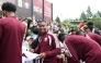 Qatar midfielder Assim Madibo signs autographs for young fans in Santa Barbara, California, on Friday. 