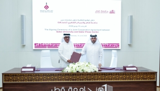 Director General of the Qatar Press Center Sadiq Mohammed Al Amari and Vice President for Academic Affairs at Qatar University Prof Ibrahim Mohammed Al Kaabi exchanging documents after signing the agreement.