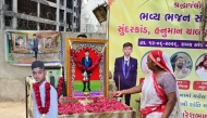 A family member of Air India plane crash victim Akash Patni pays tribute at the crash site on the first anniversary of the disaster in Ahmedabad on June 12, 2026. (Photo by Shammi Mehra / AFP)