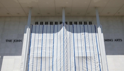 Tarps are hung on scaffolding outside The Kennedy Center on June 13, 2026 in Washington, DC. Friday late night workers removed the President Donald Trump's name from the Kennedy Center. (Photo by Tasos Katopodis/AFP)