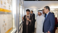 General Manager of Katara Cultural Village Foundation Professor Dr. Khalid bin Ibrahim Al-Sulaiti, Ambassador of the Republic of Tunisia to the State of Qatar H E Farhad Khalif and other officials view the gallery as artist Youssef Ftouhi explains his collection.