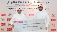 QIIB’s Head of Products Talal al-Jaidah presenting a cheque to the winner Ali Hussain H AL Baker.