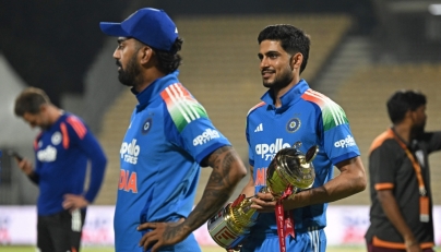 India's captain Shubman Gill holds the series trophy after his team's victory at the end of the third one-day international (ODI) cricket match between India and Afghanistan. (Photo by R. Satish Babu / AFP) 