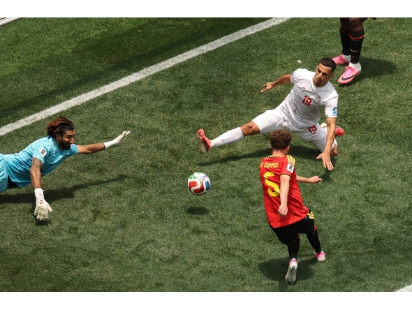 Iran's goalkeeper #01 Alireza Beiranvand makes a save past Belgium's defender #05 Maxim De Cuyper during the 2026 World Cup Group G football match between Belgium and Iran at the Los Angeles Stadium in Inglewood on June 21, 2026. (Photo by Etienne Laurent / AFP)