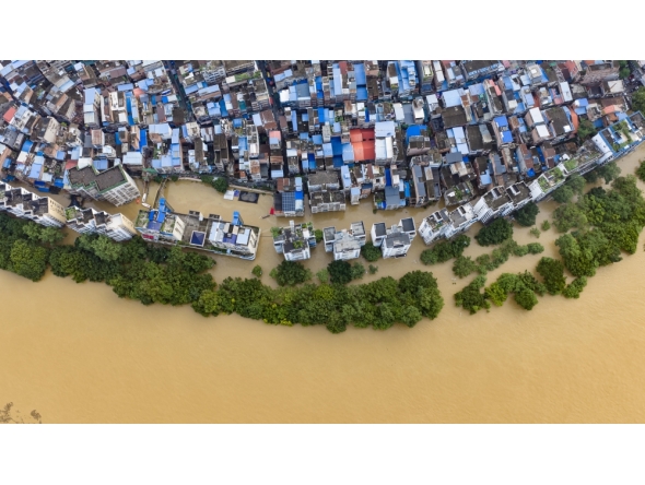 An aerial drone photo taken on June 22, 2026 shows the flood peak passing through the Liujiang River in Liuzhou, south China's Guangxi Zhuang Autonomous Region. (Photo by Li Hanchi/Xinhua)
