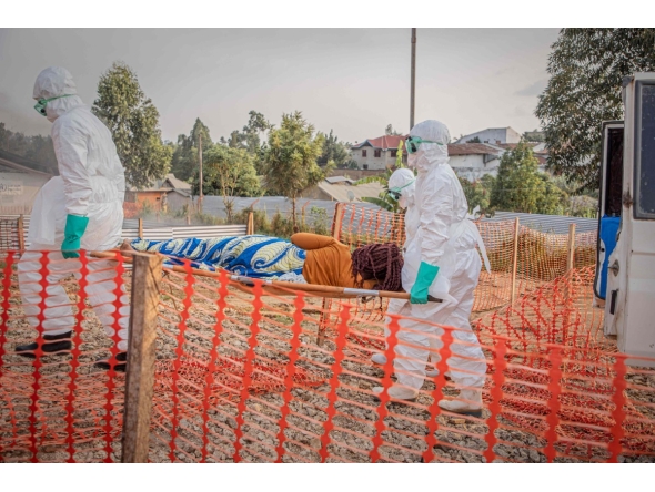 Healthcare workers carry on a stretcher a patient suffering from the Ebola virus disease from an ambulance at the Ebola Treatment Center (ETC) in Bunia, Ituri, in the east of the Democratic Republic of Congo on June 23, 2026. (Photo by Benediction MURHABAZI / AFP)