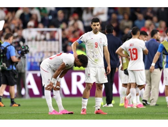 Ramin Rezaeian (left) and Mehdi Taremi of Iran react after the 1-1 draw against Egypt. PIC: AFP