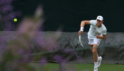 Italy's Jannik Sinner returns to his training partner at the practice courts at The All England Lawn Tennis and Croquet Club in Wimbledon on June 28, 2026. (Photo by Adrian Dennis / AFP)