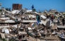 Volunteers and residents search for survivors on the rubble of collapsed buildings in Caraballeda, La Guaira state, Venezuela, on June 28, 2026, following earthquakes. Photo by Miguel MEDINA / POOL / AFP