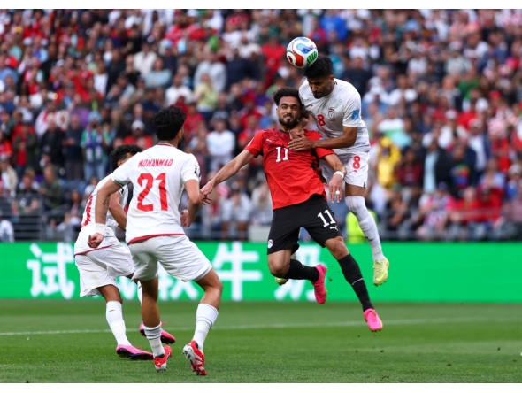 SEATTLE, WASHINGTON - JUNE 26: Mostafa Zico #11 of Egypt competes for a header against Emam Ashour #8 of Egypt during the FIFA World Cup 2026 Group G match between Egypt and IR Iran at Seattle Stadium on June 26, 2026 in Seattle, Washington.  (Photo by Dean Mouhtaropoulos / GETTY IMAGES NORTH AMERICA / Getty Images via AFP)

