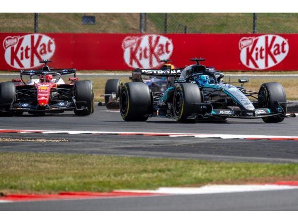 Mercedes' British driver George Russell (R) leads Ferrari's Monegasque driver Charles Leclerc (L) during the sprint race ahead of the Formula One British Grand Prix at the Silverstone motor racing circuit in Silverstone, central England, on July 4, 2026. (Photo by Andrej ISAKOVIC / AFP)