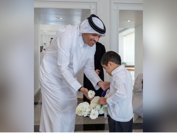 Prime Minister and Minister of Foreign Affairs H E Sheikh Mohammed bin Abdulrahman bin Jassim Al-Thani with a child. Picture shared by the Education Minister in a social media post.  