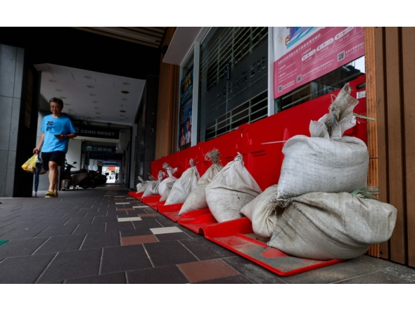 Sandbags are stacked outside a building ahead of the arrival of Typhoon Bavi in Keelung on July 10, 2026 (Photo by I-Hwa Cheng / AFP)
 