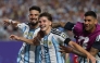 Argentina's forward #09 Julian Alvarez (C) celebrates scoring his team's second goal with Argentina's forward #21 Jose Manuel Lopez (L) and Argentina's defender #13 Cristian Romero. Photo by Odd Andersen / AFP