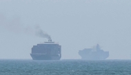 This frame grab taken from AFPTV video footage on July 12, 2026, shows cargo ships anchoring near the Strait of Hormuz off the eastern coast of the United Arab Emirates at Khor Fakkan. (Photo by AFPTV / AFP) 
