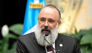 Guatemala's Minister of Culture and Sports Luis Mendez speaks during a press conference on new findings in the decipherment of hieroglyphs on Maya murals at the Xultun archaeological site, at the National Palace of Culture in Guatemala City on July 13, 2026. (Photo by Johan Ordonez / AFP)
