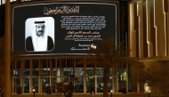 A building in Doha displays a tribute to the late Father Amir H H Sheikh Hamad bin Khalifa Al Thani. Pic: Rajan Vadakkemuriyil/The Peninsula