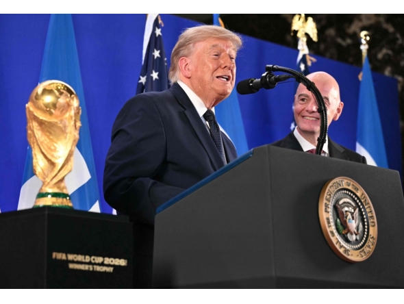 FIFA President Gianni Infantino (R) listens to US President Donald Trump speak during a FIFA reception at Trump Tower in New York on July 17, 2026. President Trump will attend the 2026 World Cup Final between Spain and Argentina. (Photo by Mandel NGAN / AFP)