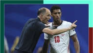England coach Thomas Tuchel speaks with Jude Bellingham during the semi-final against Argentina. 