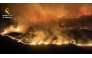 This screen grab taken from handout aerial video footage released on July 18, 2026 by Spain's Pegaso unit of the Guardia Civil shows a massive wildfire, in Cinco Villas area, near Zaragoza, in a sparsely populated part of the Aragon region in northeastern Spain. (Photo by Handout / Spanish Guardia Civil / AFP)