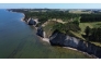This aerial view shows the Hanklit cliff overlooking Limfjord on the Danish island of Mors, Denmark on July 9, 2026. (Photo by James Brooks / AFP)