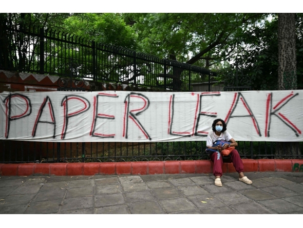 A Cockroach Janta Party (CJP) supporter sits at Jantar Mantar in New Delhi on July 23, 2026 during the ongoing protest. (Photo by Sajjad Hussain / AFP)