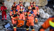 Rescuers work at the site of a landslide in Pengshui Miao and Tujia Autonomous County, southwest China's Chongqing Municipality, July 18, 2026. (Xinhua/Wang Quanchao)