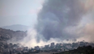 This image taken from the vicinity of the village Zawtar al-Sharqiyah in southern Lebanon, shows smoke rising from the site of an explosion carried out by the Israeli military, in the village of Kfar Tibnit on July 23, 2026. (Photo by ibrahim AMRO / AFP) /