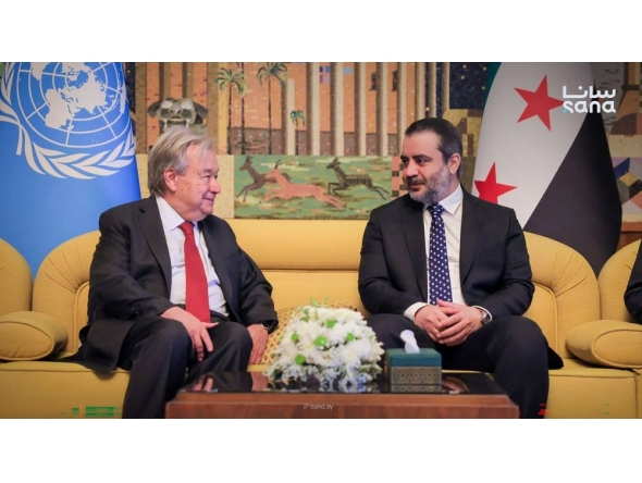 This handout picture taken and released by the official Syrian Arab News Agency (SANA) on July 25, 2026 shows syria's Foreign Affairs Minister Asaad al-Shaibani (R) receiving UN Secretary-General Antonio Guterres (L) at Damascus International Airport in Damascus. (Photo by SANA / AFP)