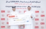 Retail Branches Manager at QIIB Abdullah Hamad Al-Mesaifri presenting the QR1m cheque to the winner, Enas Jamal A S Nasser.