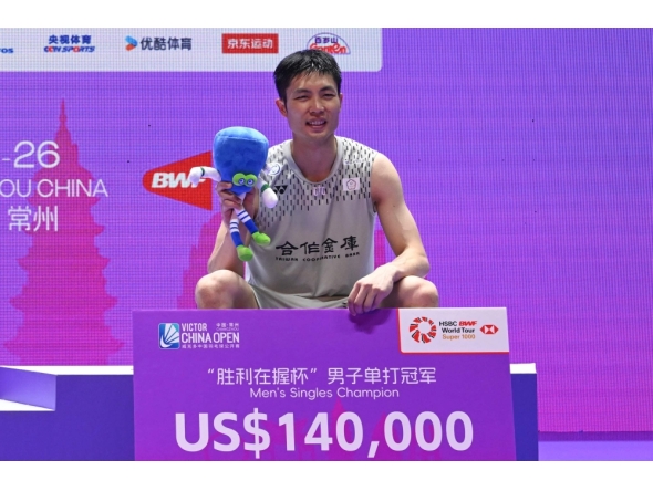 Taiwan's Chou Tien-chen poses on the podium at China Open badminton tournament in Changzhou, eastern China's Jiangsu province on July 26, 2026. (Photo by CN-STR / AFP)